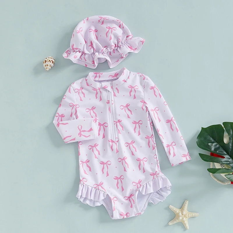 Maillot de bain rashguard à manches longues pour fille avec imprimé nœud et chapeau assorti pour s'amuser à la plage et à la piscine