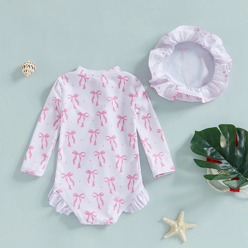 Maillot de bain rashguard à manches longues pour fille avec imprimé nœud et chapeau assorti pour s'amuser à la plage et à la piscine