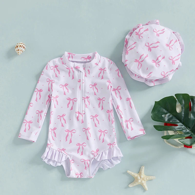 Maillot de bain rashguard à manches longues pour fille avec imprimé nœud et chapeau assorti pour s'amuser à la plage et à la piscine
