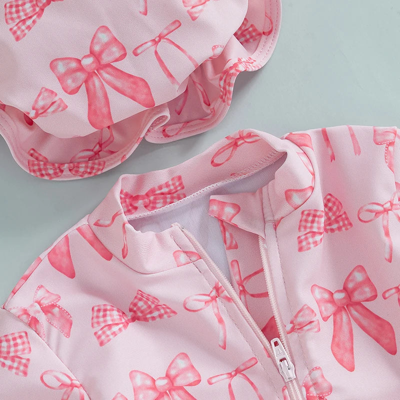 Maillot de bain rashguard à manches longues pour fille avec imprimé nœud et chapeau assorti pour s'amuser à la plage et à la piscine
