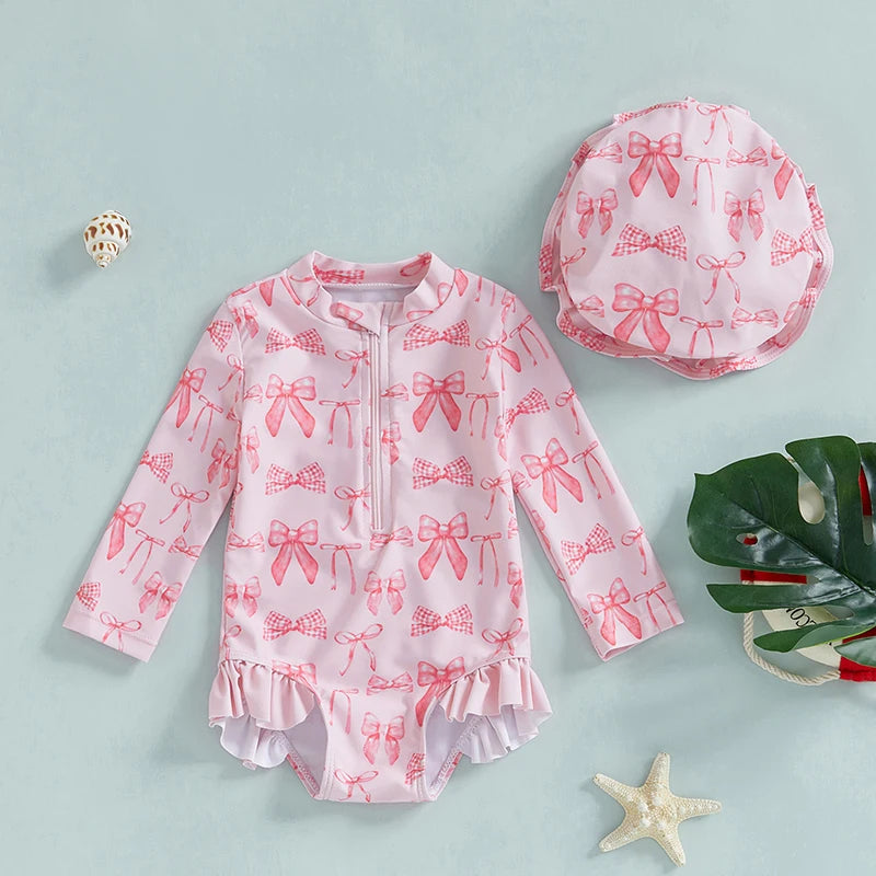 Maillot de bain rashguard à manches longues pour fille avec imprimé nœud et chapeau assorti pour s'amuser à la plage et à la piscine
