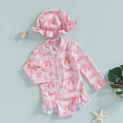 Maillot de bain rashguard à manches longues pour fille avec imprimé nœud et chapeau assorti pour s'amuser à la plage et à la piscine
