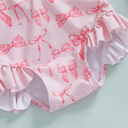 Maillot de bain rashguard à manches longues pour fille avec imprimé nœud et chapeau assorti pour s'amuser à la plage et à la piscine